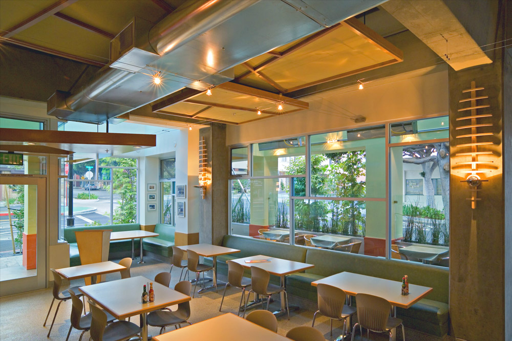 Good Stuff custom design elements: fish skeleton lighting, surfboard counter, custom entrance and ceiling tiles